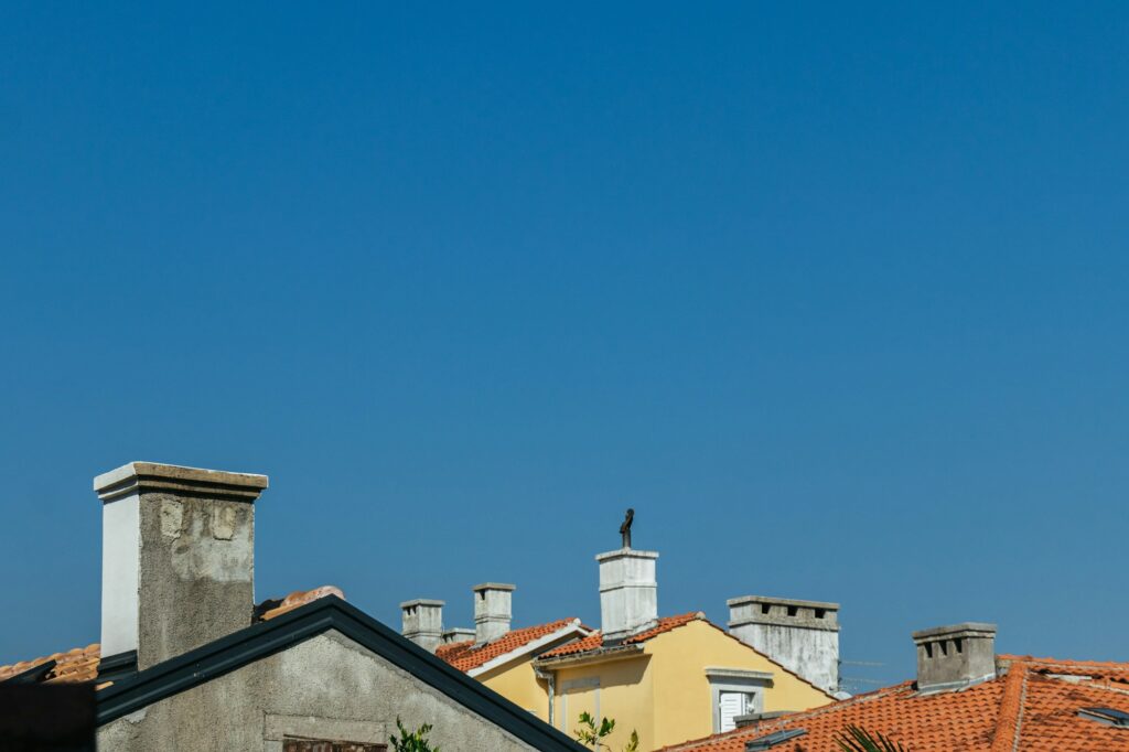 Croatian Rooftops with Chimneys under a Sunny Sky