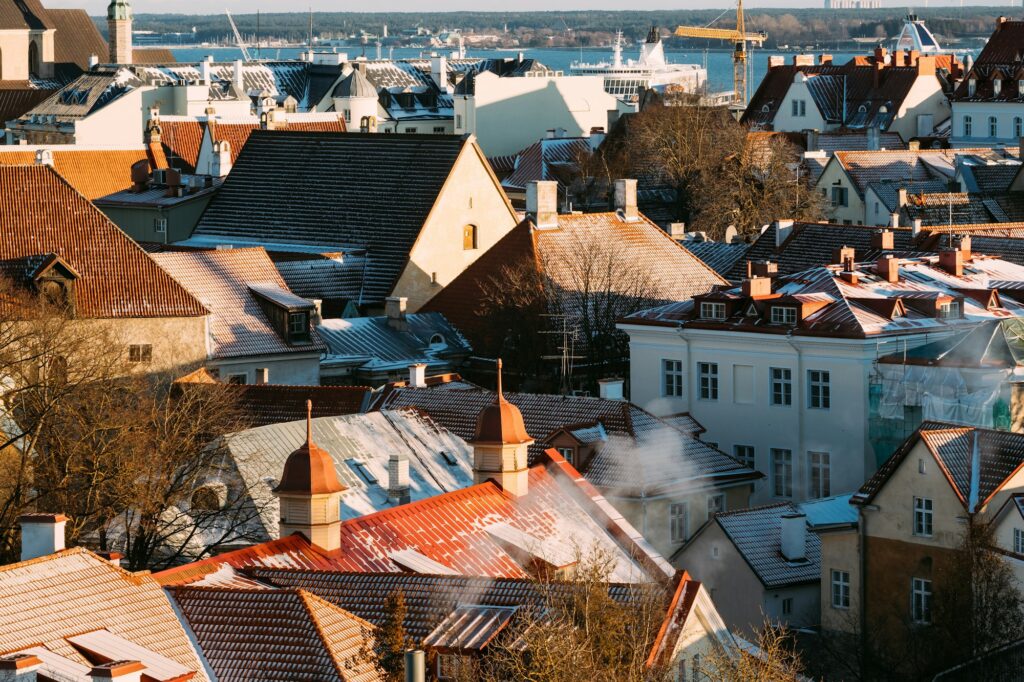 Tallinn, Estonia. Top View Of Old Tiles Roofs Of Residential Hou
